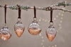 Nkuku CHRISTMAS DECORATIONS Nevasa Baubles - Clear & Antique Copper (Set of 4)